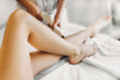 © Strelciuc - Beautiful legs of an young woman that is in a salon and doing epilation.