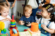 © Rawpixel.com - Nursery children playing with teacher in the classroom
