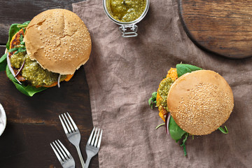 Vegetarian burger pumpkin spinach arugula pesto top view Healthy food