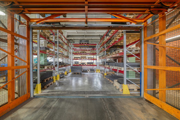 Wall Mural - Factory warehouse steel reinforcement. High stacked shelving.