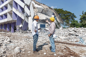 Engineer architect and worker operation control demolish old building.