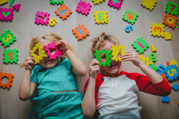 Wall Mural - happy cute girl and boy learn numbers and shapes