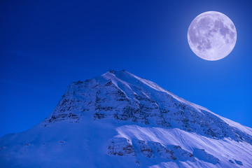 Wall Mural - the polar arctic full red super moon eclipse sky star in norway svalbard in longyearbyen city mounta