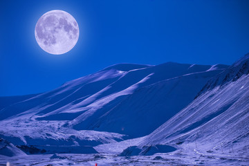 Wall Mural - the polar arctic full red super moon eclipse sky star in norway svalbard in longyearbyen city mounta