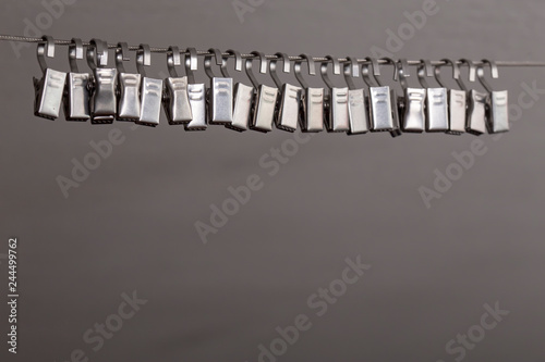 Metal Hooks For Curtains Hanging On A String In White Ceiling