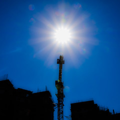 Wall Mural - Building under construction and a construction crane against the