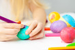 © FOTO_STOCKER - Green egg, colorful markers, heart pattern, on egg. Happy family is preparing for Easter and painting eggs