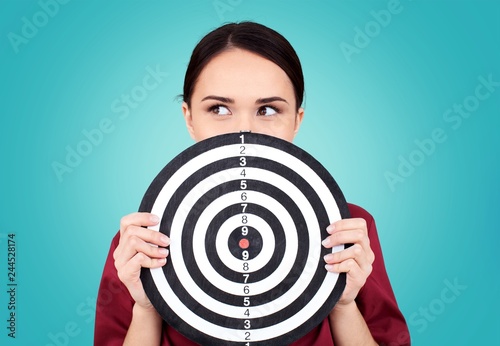 Cuadros en Lienzo Beautiful businesswoman portrait holding round target of darts
