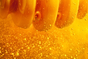 Honey with gold color flows down from a spoon. Healthy food concept. Healthy eating. Diet. Selective focus.