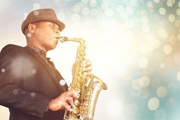 Canvas Print - Close-up man playing on saxophone on background