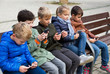 © JackF - Children with phone outdoors