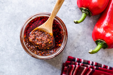 Hot Mexican Spicy Chili Red Sauce Salsa Macha with Red Pepper Powder in Jar.