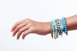 © 5second - Female hand with bracelets on white background