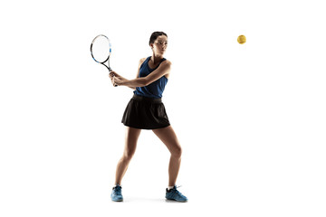 Wall Mural - Full length portrait of young woman playing tennis isolated on white background. Healthy lifestyle. The practicing, fitness, sport, exercise concept. The female model in motion or movement