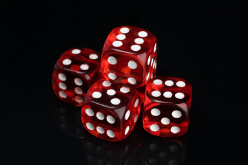 set of red transparent gaming dice on a black background