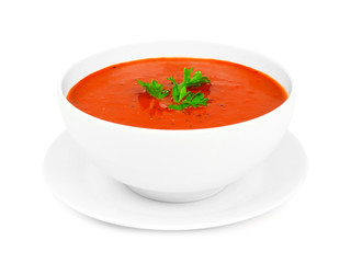 Poster - Homemade tomato soup in a white bowl with saucer. Side view isolated on a white background.