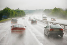 Traffics On A Rainy Wet Highway In Fog Water Spray