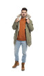 © New Africa - Young man wearing warm clothes on white background. Ready for winter vacation