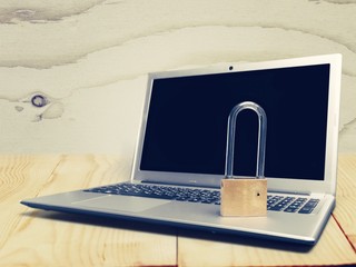 Canvas Print - Lock on the laptop  background,Cyber safety concept