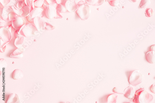 Flowers composition. Rose flower petals on pastel pink background. Valentines day, mothers day, womens day concept. Flat lay, top view, copy space © Flaffy