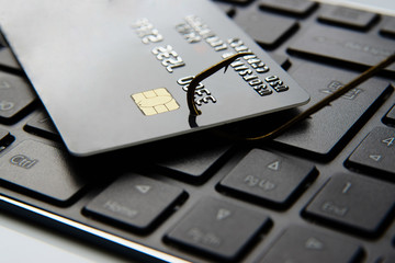 Credit card phishing attack. Credit card a fish hook, close-up