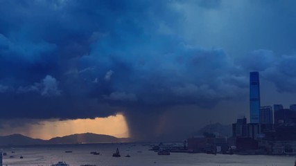 Fototapete - Victoria harbor of Hong Kong Island with sunny stormy sky, China