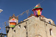 Colorful lanterns hang in front of church