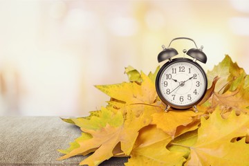 Retro alarm clock on table  background