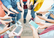 Group of friends using their smart mobile phones - Millennial young people addicted to new technology trends - Concept of people, generation z, tech, social media network and youth lifestyle