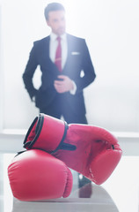 Boxing gloves on the businessman's desktop