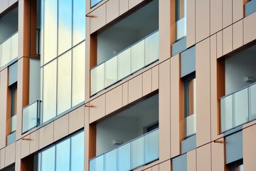 Modern apartment buildings on a sunny day with a blue sky. Facade of a modern apartment building