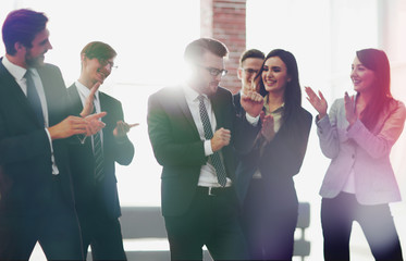 Canvas Print - A team of  business people congratulating each other.