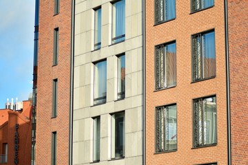 Modern apartment buildings on a sunny day with a blue sky. Facade of a modern apartment building