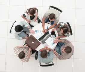 Wall Mural - top view.the business team holds a round table