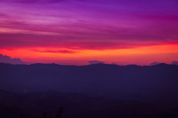 Wall Mural - silhouette of mountains on orange and purple sky