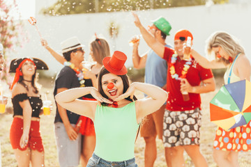 Brazilian Carnival. Group of Brazilian people in costume celebrating the carnival party in the city