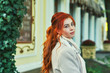 © fisher05 - Young redheaded woman in town .  Girl wearing a coat