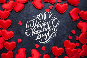 Valentines Day card with red hearts and Happy Valentine's Day hand lettering calligraphy text on black  background. 14 February Valentines day of love.