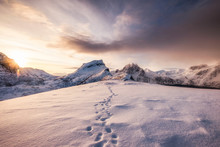 Landscape Of Snow Mountains Range With Footprint On Snowy At Sunrise