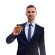© Elena Kharichkina - Confident young business man standing isolated over white background, showing credit card