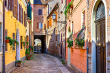 Fototapeta Uliczki - Cozy narrow street in Ferrara, Emilia-Romagna, Italy. Ferrara is capital of the Province of Ferrara