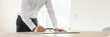 © Gajus - Wide view image of businessman signing a document