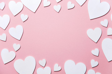 Wall Mural - White hearts on a pastel pink background. Valentine's day, Mother's day background