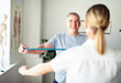 © Louis-Paul Photo - A Modern rehabilitation physiotherapy worker with senior client