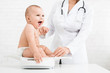 © Prostock-studio - Adorable little baby child with female pediatrician