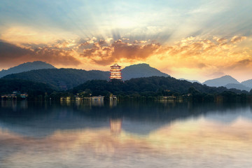 Wall Mural - Ancient Chinese Pagoda at Sunset, West Lake, Hangzhou, China