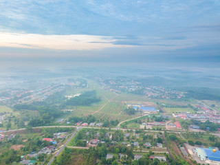 Wall Mural - Aerial view of mountain and morning mist during sunrise.