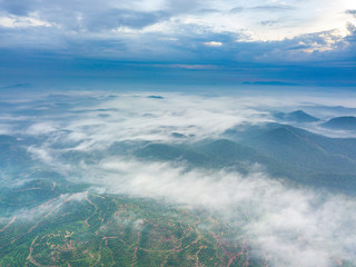 Wall Mural - Aerial view of mountain and morning mist during sunrise.