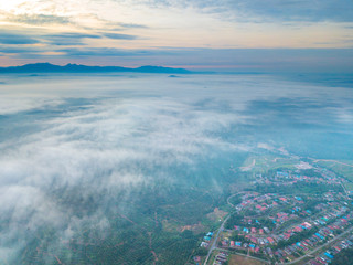 Wall Mural - Aerial view of mountain and morning mist during sunrise.