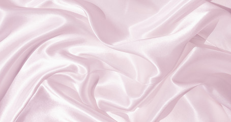 The texture of the satin fabric of lilac color for the background